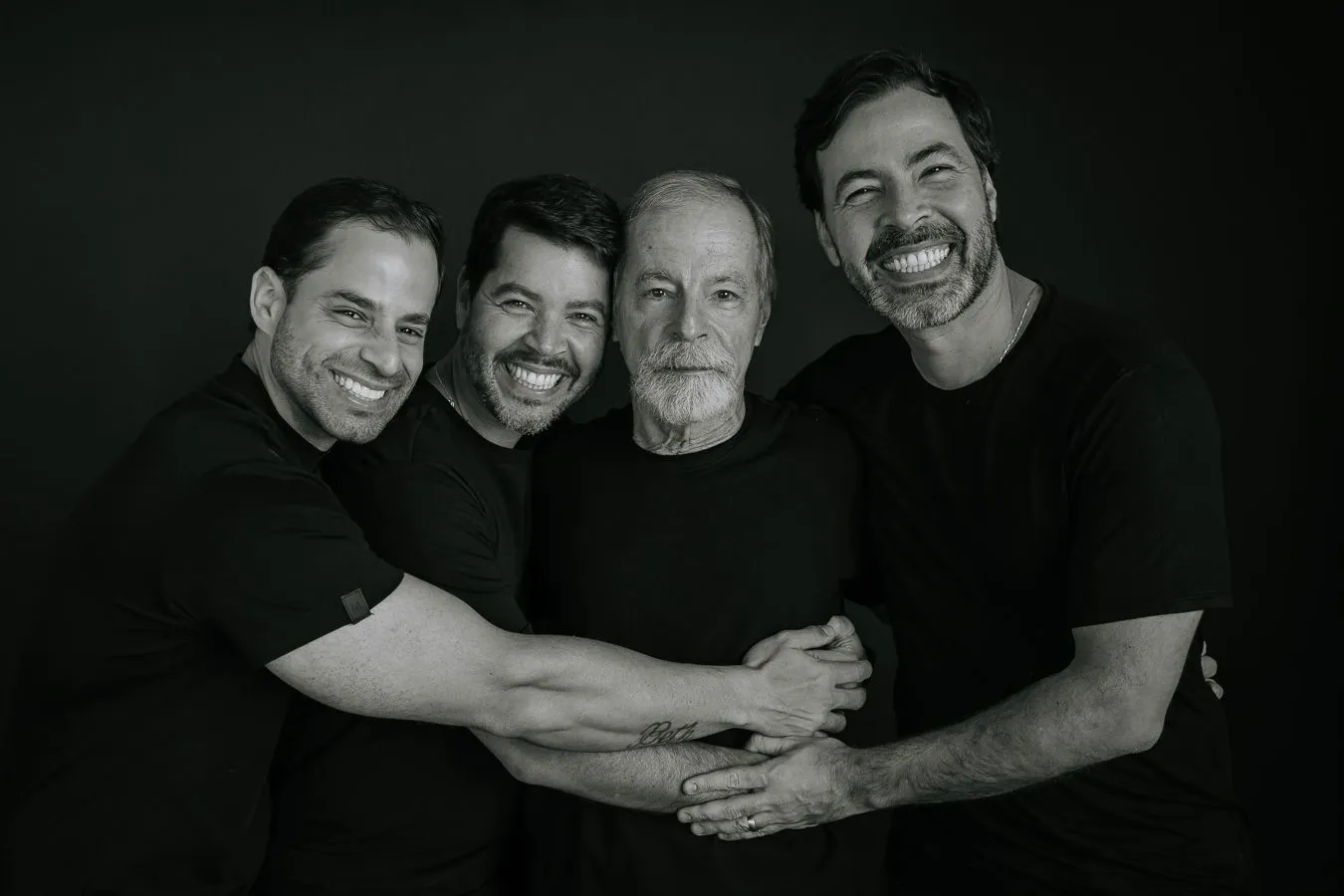 The Dellacqua brothers embracing their father